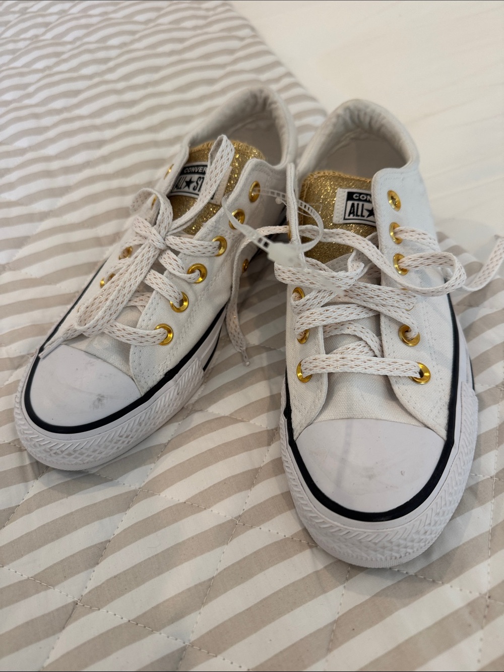 NWOT….Converse White Low Top Sneakers with Gold Accents